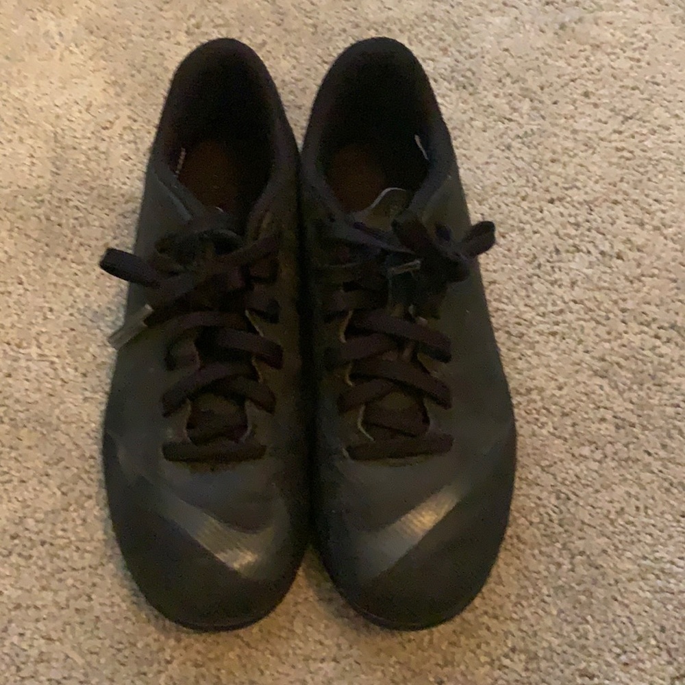 Kid’s NIKE black cleats. Size 2.5y.